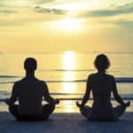 couple in rehab meditating