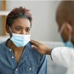 patient getting treatment by doctor during pandemic